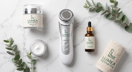 Flatlay of advanced facial treatment tools and skincare products used in a clinic setting